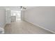 Spacious living room features stylish laminate flooring and a modern ceiling fan to add modern touch at 5340 Big Bass Dr, Raleigh, NC 27610