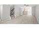 Bright living room with laminate flooring and staircase with great access to the kitchen at 5340 Big Bass Dr, Raleigh, NC 27610