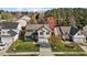 An aerial view of the house and surrounding neighborhood showcases the property's location at 5405 Seaspray Ln, Raleigh, NC 27610