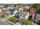 An elevated view of a home with an attached garage, landscaped yard, and neighborhood at 5405 Seaspray Ln, Raleigh, NC 27610