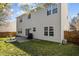 The house boasts a backyard with a lawn and a patio, perfect for outdoor entertainment at 5405 Seaspray Ln, Raleigh, NC 27610