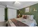 Charming bedroom with a comfortable bed, decorative pillows, and classic decor, creating a serene retreat at 5405 Seaspray Ln, Raleigh, NC 27610