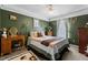 Comfortable bedroom with a cozy bed, vintage vanity, and soft lighting to create a relaxing atmosphere at 5405 Seaspray Ln, Raleigh, NC 27610