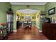 Spacious dining room with hardwood floors, chandelier lighting and decorative shelving at 5405 Seaspray Ln, Raleigh, NC 27610