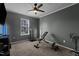 Dedicated exercise room with carpeted floors, a treadmill, weight bench and other fitness equipment at 5405 Seaspray Ln, Raleigh, NC 27610