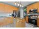 Modern kitchen with stainless steel appliances and center island at 5405 Seaspray Ln, Raleigh, NC 27610