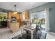 Bright kitchen featuring a table, sliding glass door to the backyard, and ample counter space at 5405 Seaspray Ln, Raleigh, NC 27610