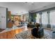 Inviting living room with hardwood floors that opens to the adjacent kitchen, offering a cozy atmosphere at 5405 Seaspray Ln, Raleigh, NC 27610