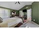 Spacious main bedroom features a cozy bed, TV, and stylish furniture, creating a perfect blend of comfort and functionality at 5405 Seaspray Ln, Raleigh, NC 27610