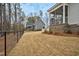 Home featuring fenced backyard, screened-in porch, and wooded backdrop at 5450 Hunter Hill Rd, Rocky Mount, NC 27804