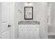 Charming bathroom features a granite countertop, modern fixtures, and framed mirror at 5450 Hunter Hill Rd, Rocky Mount, NC 27804