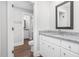 Bathroom showcasing white vanity, granite countertop, and connecting powder room at 5450 Hunter Hill Rd, Rocky Mount, NC 27804