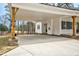 A spacious carport with wooden beams offers ample parking and protection from the elements at this lovely home at 5450 Hunter Hill Rd, Rocky Mount, NC 27804