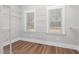 Walk-in closet with wire shelving, storage and natural light from two windows at 5450 Hunter Hill Rd, Rocky Mount, NC 27804