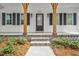 Front door with brick stairs and wooden support beams at 5450 Hunter Hill Rd, Rocky Mount, NC 27804