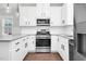 Kitchen with stainless steel appliances, granite countertops, and white cabinets at 5450 Hunter Hill Rd, Rocky Mount, NC 27804