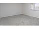 Bedroom with carpet, a window letting in natural light, and neutral colors at 602 N Mineral Springs Rd, Durham, NC 27703