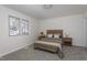 Bedroom with carpet, natural light, and a comfy bed with matching bedside tables at 602 N Mineral Springs Rd, Durham, NC 27703