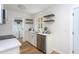 Modern kitchen area featuring white cabinetry, and stainless-steel appliances at 602 N Mineral Springs Rd, Durham, NC 27703