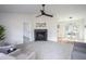 Bright living room featuring a cozy fireplace and neutral color palette at 602 N Mineral Springs Rd, Durham, NC 27703