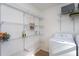 Pantry featuring metal shelving with ample storage space and a modern washing machine at 602 N Mineral Springs Rd, Durham, NC 27703