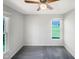 A cozy bedroom featuring carpet, a ceiling fan, and a bright window at 610 Shepard School Rd, Zebulon, NC 27597