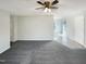 Spacious living room featuring neutral paint, ceiling fan, carpet and ample room for furniture at 610 Shepard School Rd, Zebulon, NC 27597