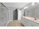 Bathroom featuring dual sinks and a glass walk-in shower at 63 Halter Ct, Angier, NC 27501