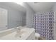 This bathroom has modern fixtures and vanity, and patterned shower curtain at 63 Halter Ct, Angier, NC 27501