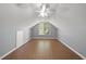 Bright bedroom with laminate flooring, ceiling fan, and natural light from the large window at 63 Halter Ct, Angier, NC 27501