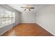 Cozy bedroom featuring large windows and hardwood floors at 63 Halter Ct, Angier, NC 27501