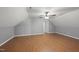 Spacious bedroom featuring laminate flooring, a ceiling fan, and a doorway to another room at 63 Halter Ct, Angier, NC 27501