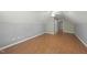 A spacious bedroom has wood floors, neutral paint, and a ceiling fan at 63 Halter Ct, Angier, NC 27501
