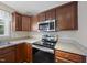 Galley kitchen featuring stainless appliances and light countertops at 63 Halter Ct, Angier, NC 27501