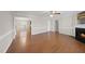 Spacious living room featuring hardwood floors and a cozy fireplace at 63 Halter Ct, Angier, NC 27501
