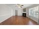 Bright living room with fireplace, ceiling fan, and hardwood floors at 63 Halter Ct, Angier, NC 27501