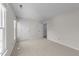 Neutral bedroom with neutral carpet and entrances to bathroom and closet at 6817 Fairpoint Ct, Raleigh, NC 27613