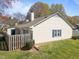 Back view of the home showing a fenced in patio and lawn at 6817 Fairpoint Ct, Raleigh, NC 27613