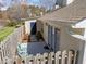 Inviting patio area with quaint chairs and a privacy fence at 6817 Fairpoint Ct, Raleigh, NC 27613