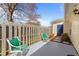 Inviting patio area with quaint chairs and a privacy fence at 6817 Fairpoint Ct, Raleigh, NC 27613