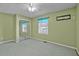 Bright bedroom with mirrored closet doors and a window view at 71 Romans Rd, Roxboro, NC 27574