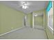 Bright bedroom with mirrored closet doors and two windows at 71 Romans Rd, Roxboro, NC 27574