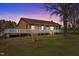 Charming ranch-style home featuring a large, covered porch, wooden facade, and a well-maintained lawn at 71 Romans Rd, Roxboro, NC 27574