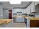 Functional kitchen with a stainless steel dishwasher and wood countertops at 71 Romans Rd, Roxboro, NC 27574