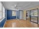 Spacious living room with hardwood floors, natural light, and sliding glass doors at 71 Romans Rd, Roxboro, NC 27574