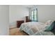 Comfortable bedroom features neutral walls and a patterned quilt for a serene, inviting space at 909 Sea Holly Dr, Zebulon, NC 27597