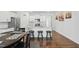 Open concept kitchen with a center island, stainless steel appliances, and modern lighting at 909 Sea Holly Dr, Zebulon, NC 27597