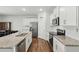 Bright kitchen with granite countertops, stainless steel appliances, and ample cabinet space at 909 Sea Holly Dr, Zebulon, NC 27597