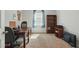 Bright office space with desk, chair, shelving and large window, perfect for work or study at 909 Sea Holly Dr, Zebulon, NC 27597