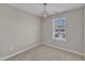 Neutral bedroom features a large window allowing natural light to fill the carpeted space at 946 Consortium Dr, Raleigh, NC 27603